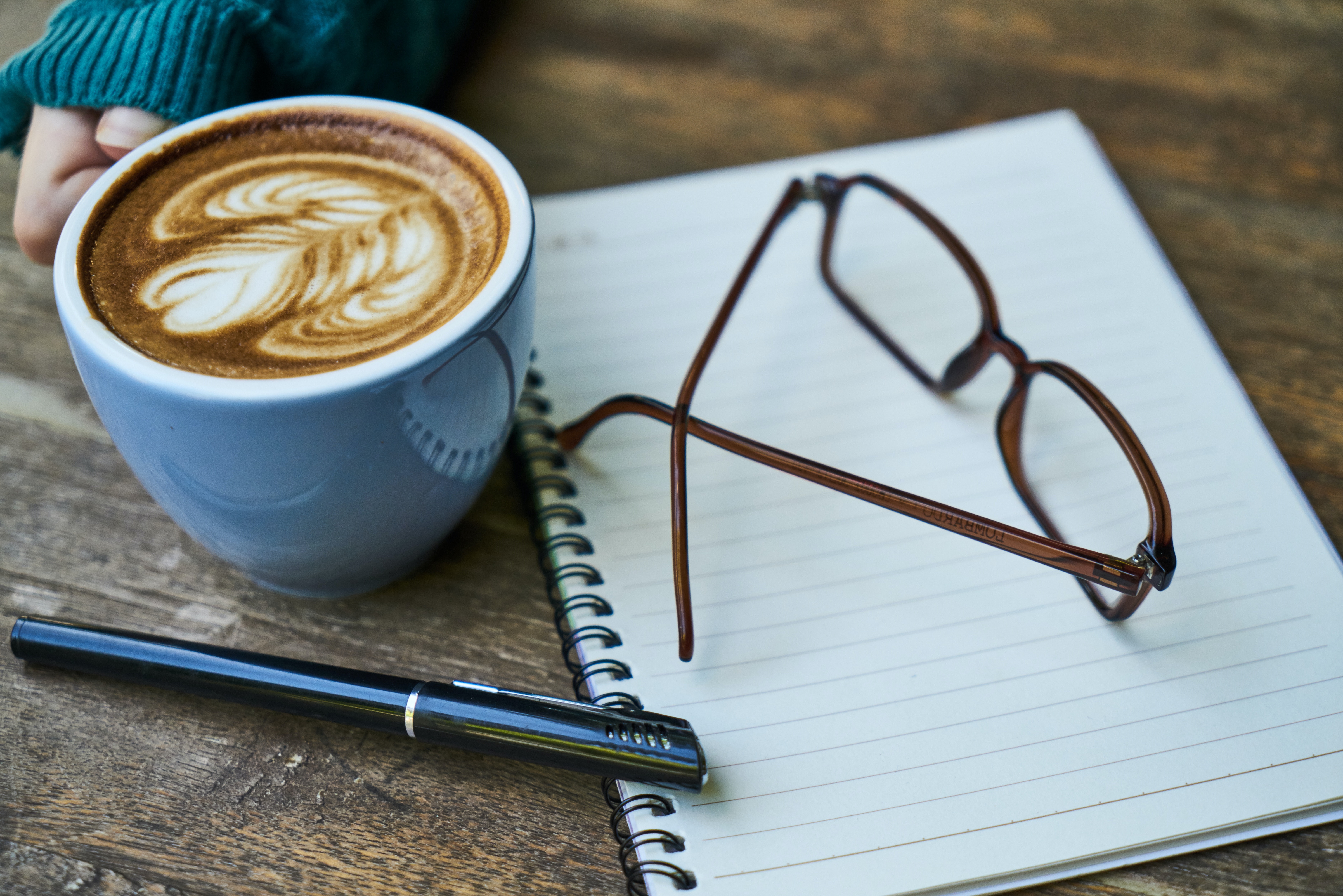 Coffee notebook and eyeglass